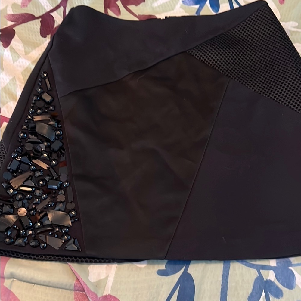Black embellished mini skirt